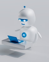 A small, round robot with a smooth white surface and blue accents operates a blue laptop on a sleek, floating platform. The robot has glowing eyes and an antenna on its head, with an 'AI' emblem on its front.