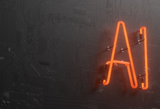 A glowing neon sign displaying the letters 'AI' is mounted on a dark, textured wall that resembles a circuit board or technological pattern.